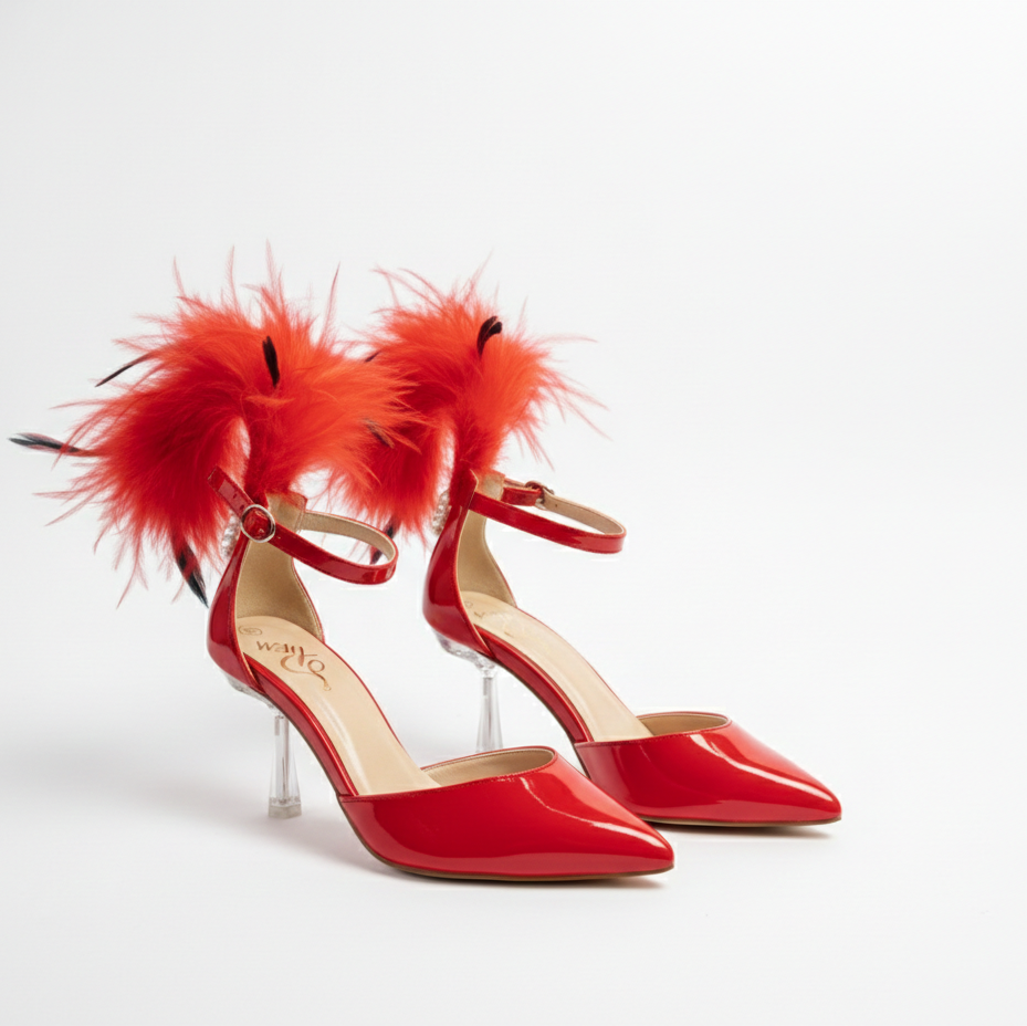 Red high-heeled shoes with feather details on a white background